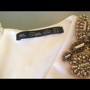 White cocktail dress with decorative beading